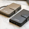 Two mobile wallet cases in jet black and charcoal grey